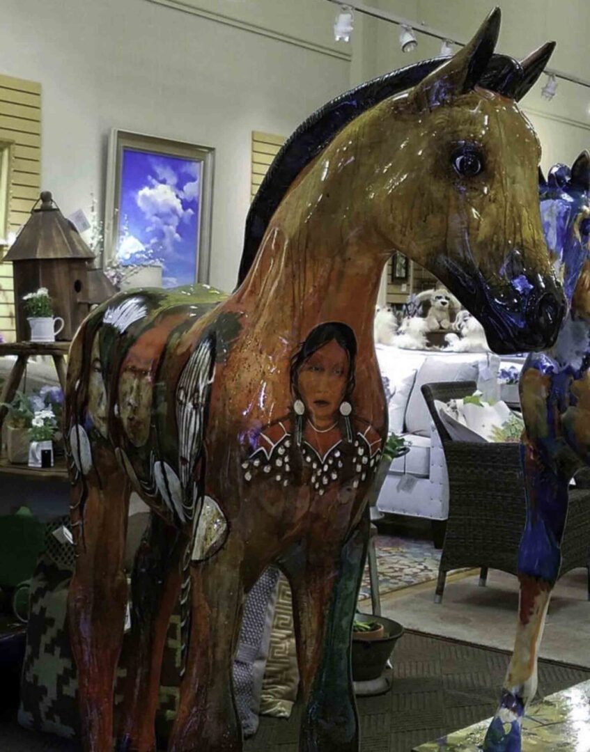 Colorful horse art display indoors