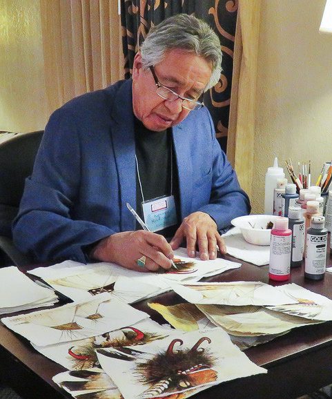 A small white dog in a stroller outside a clothing store.