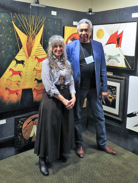 A small white dog in a stroller outside a clothing store.