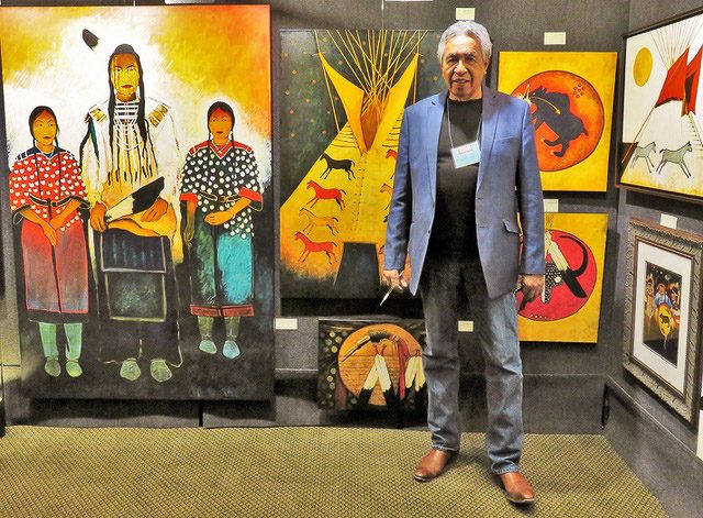 A small white dog in a stroller outside a clothing store.