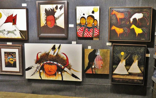 A small white dog in a stroller outside a clothing store.