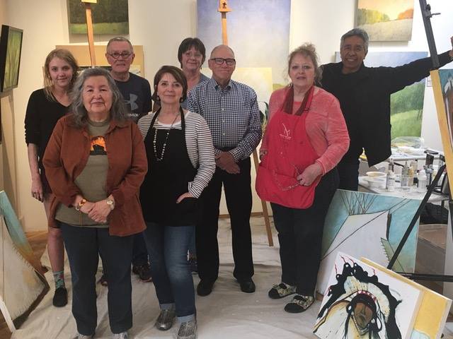 Art group posing in studio