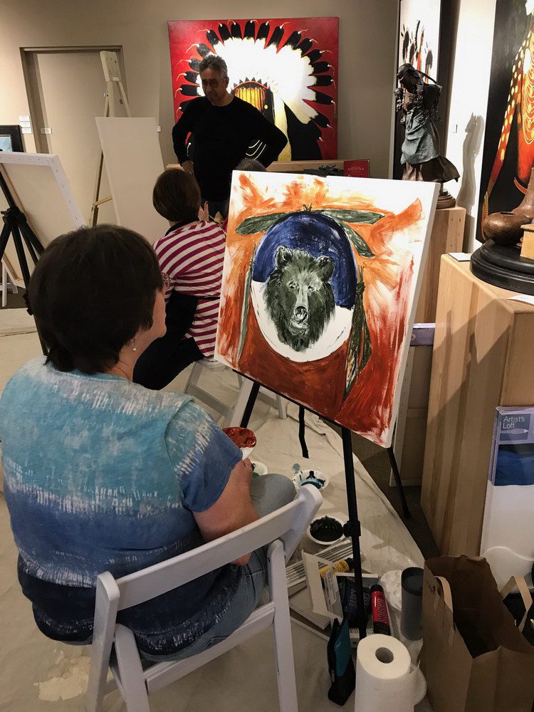 A small white dog in a stroller outside a clothing store.