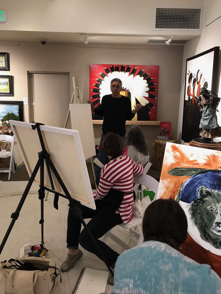 A small white dog in a stroller outside a clothing store.
