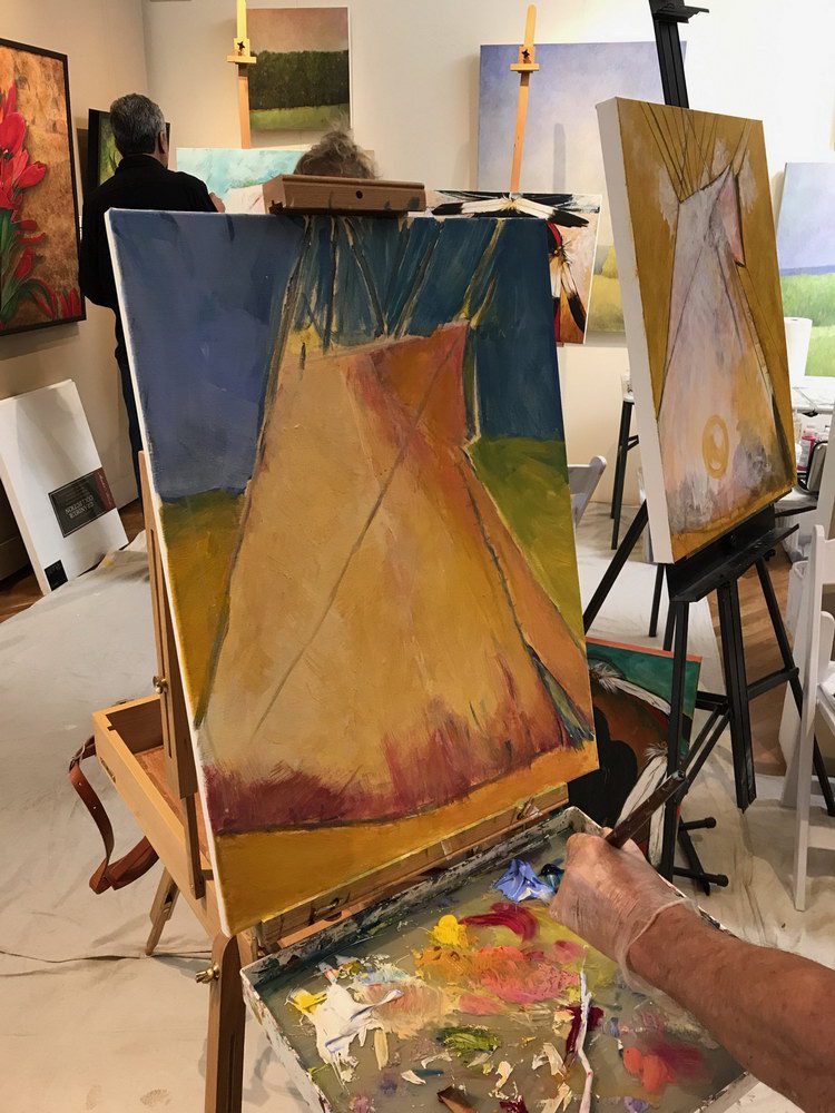 A small white dog in a stroller outside a clothing store.