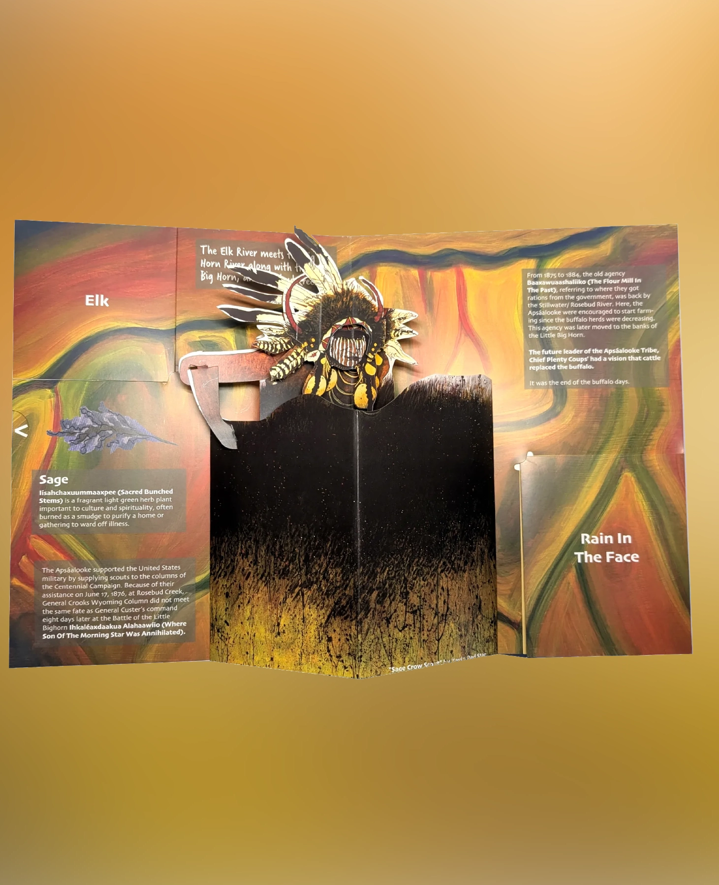 Colorful tribal artwork with text on an open booklet.