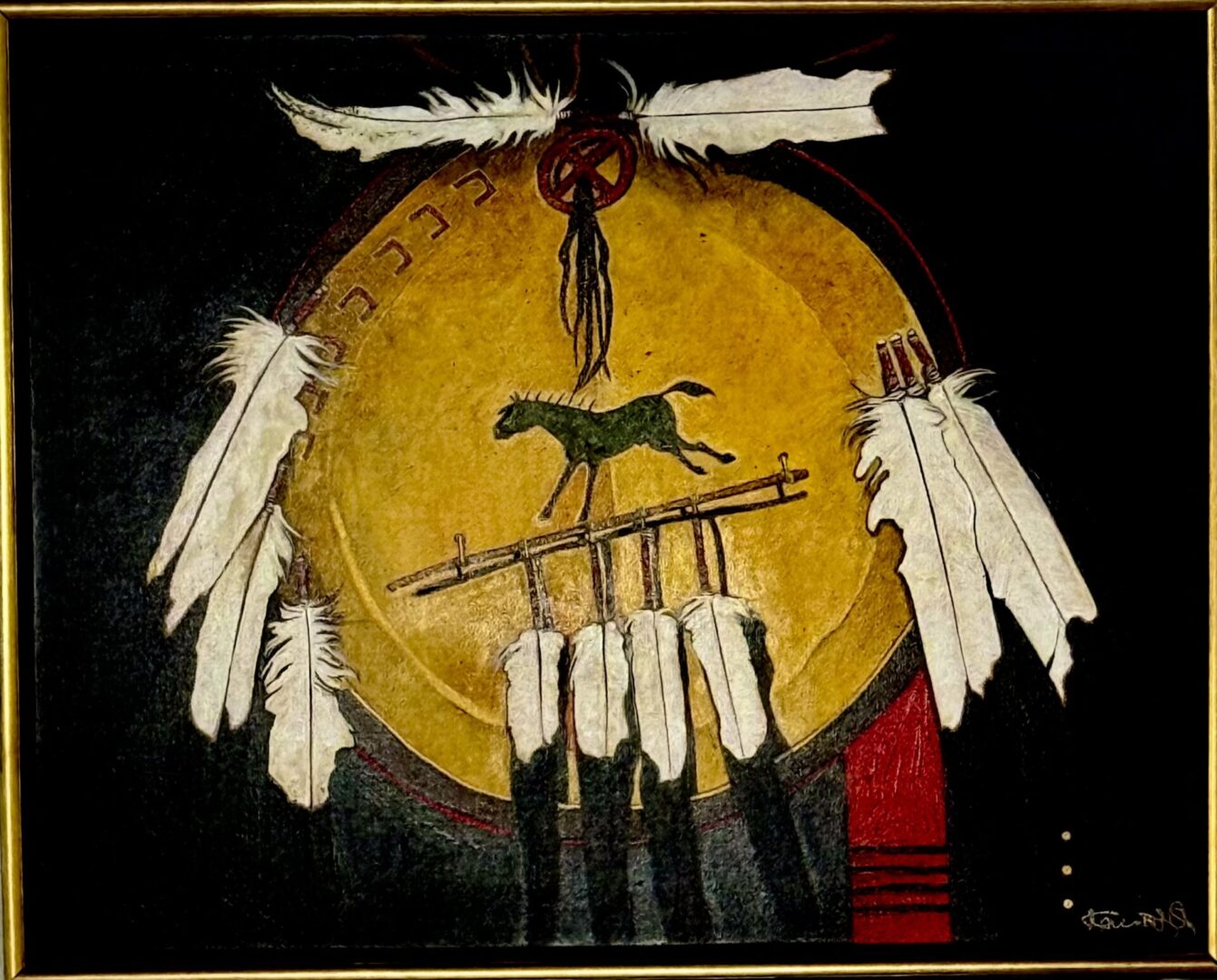 Native American inspired artwork featuring feathers and a horse on a circular drum.