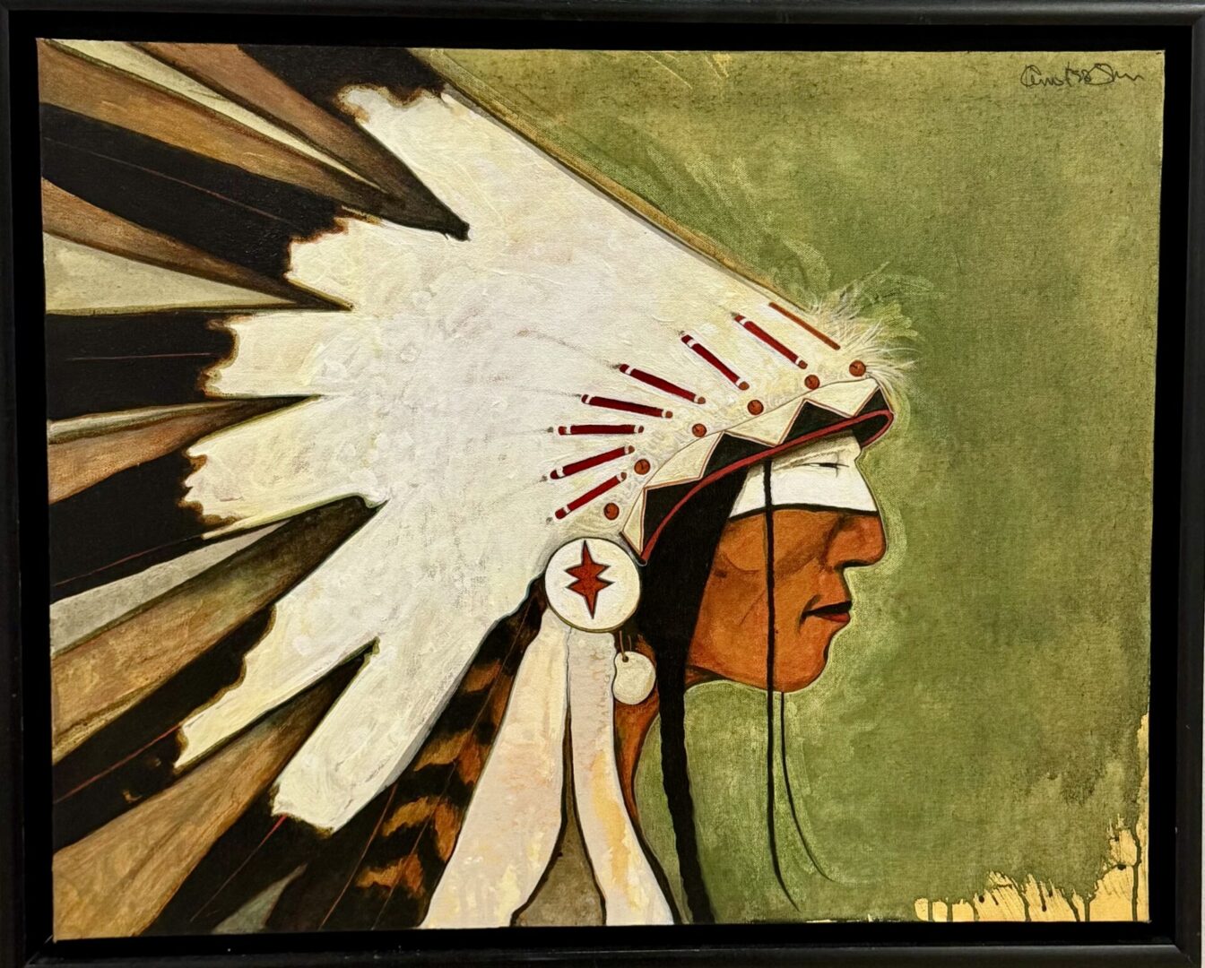 Profile of Native American chief wearing a feathered headdress against green background.