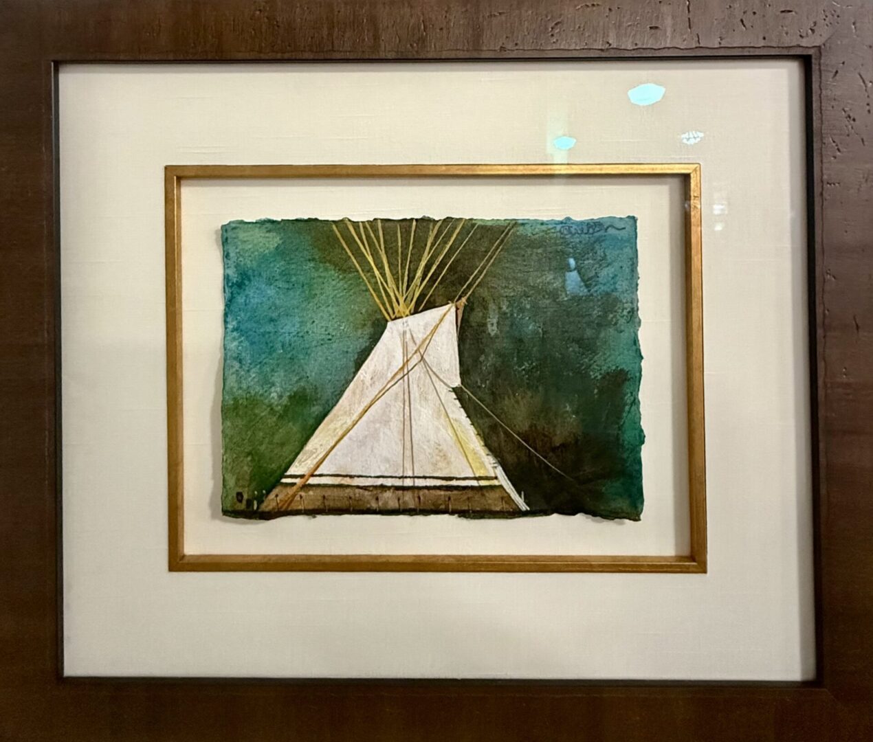 Framed painting of a white teepee against a green-blue background.