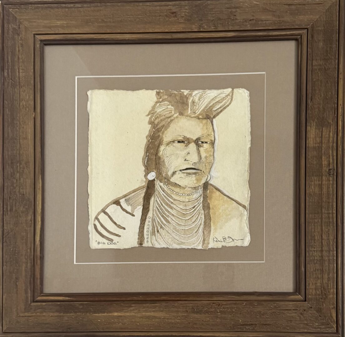 Framed sepia-toned portrait of a Native American man titled 'Big Dog'.