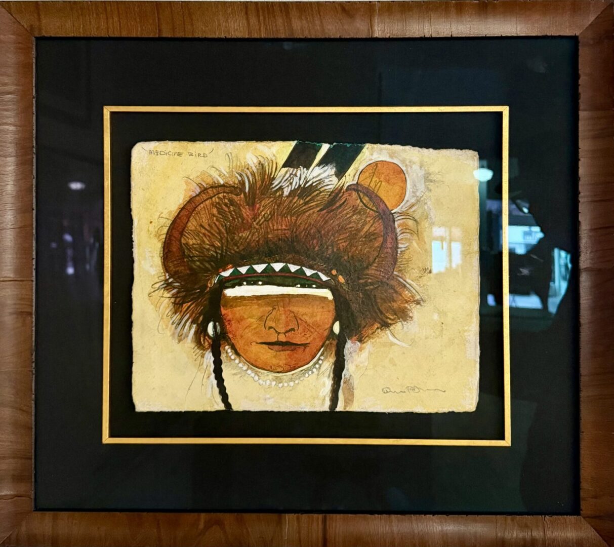 Framed artwork titled 'Medicine Bird' depicting a Native American figure with traditional headdress.