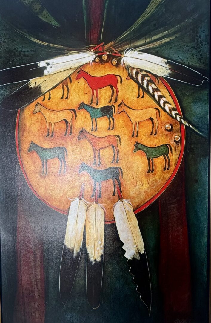 A Native American drum decorated with painted horses and feathers.
