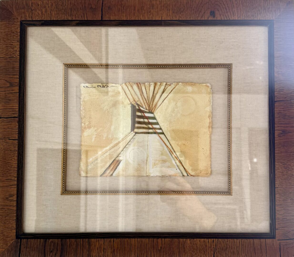Framed abstract painting with beige and black striped pattern on aged paper.
