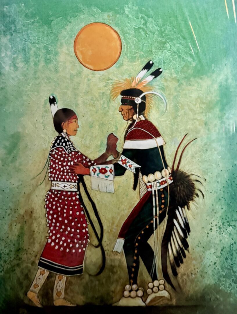 Native American couple in traditional attire under the sun.