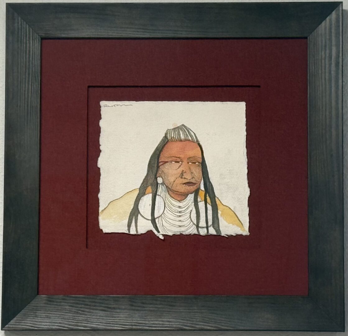 Framed watercolor portrait of a Native American figure with traditional attire and jewelry.