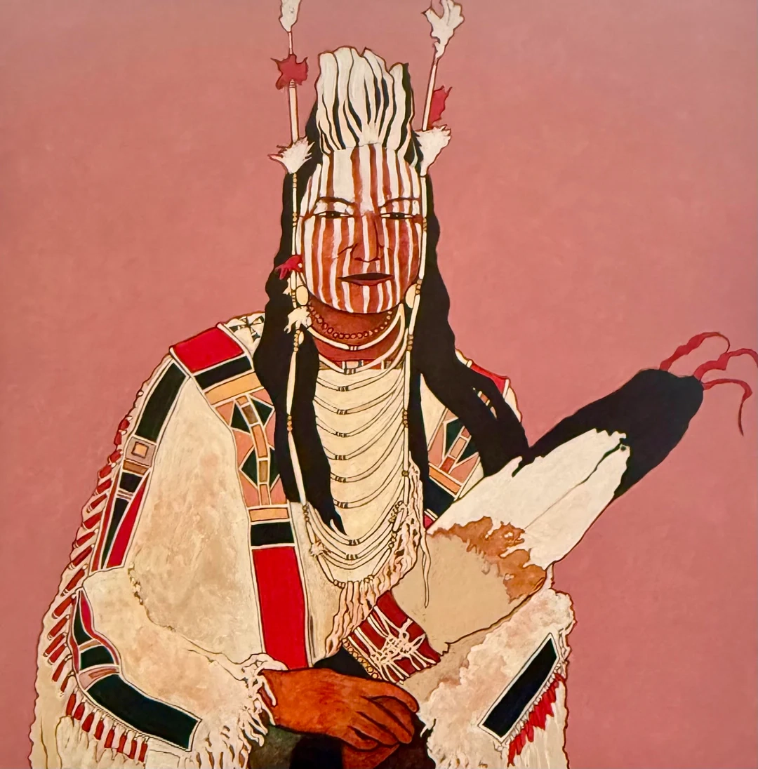 Native American portrait with traditional attire and face paint on a pink background.