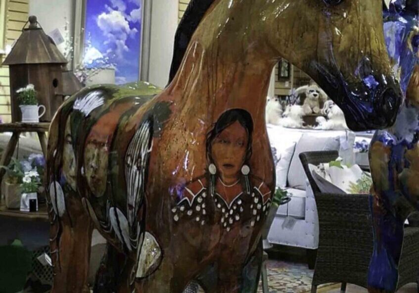 Colorful horse art display indoors